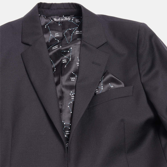 Black constellation pocket square made of viscose placed in pocket for the black Georgie blazer, which is lined with the same pattern of the pocket square
