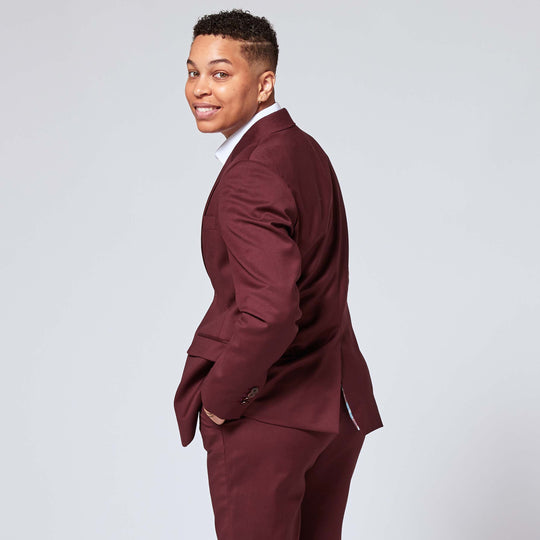 Masculine model in Georgie Burgundy Suit for women and non-binary folks