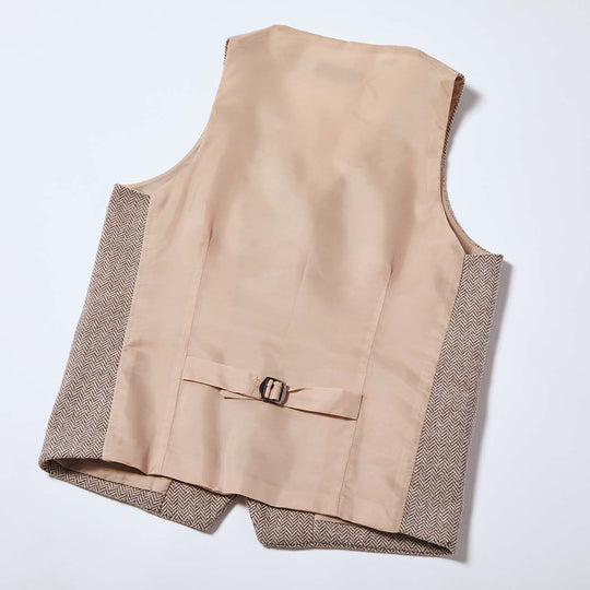 Back of taupe tweed vest with adjustable back clasp