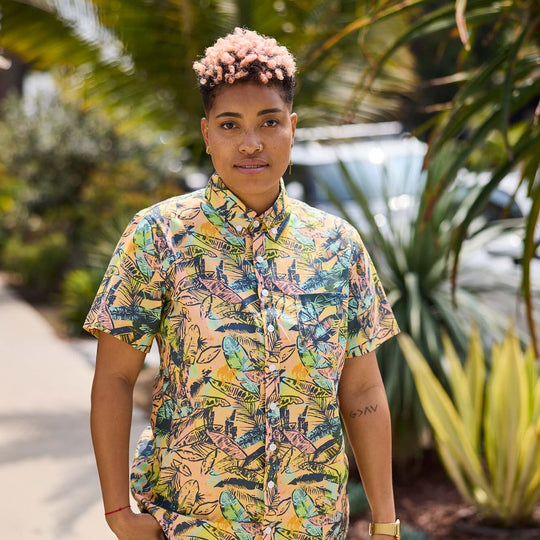 Androgynous model wearing the Piper multi-lead patterned shirt by Kirrin Finch outside on a nice summer day