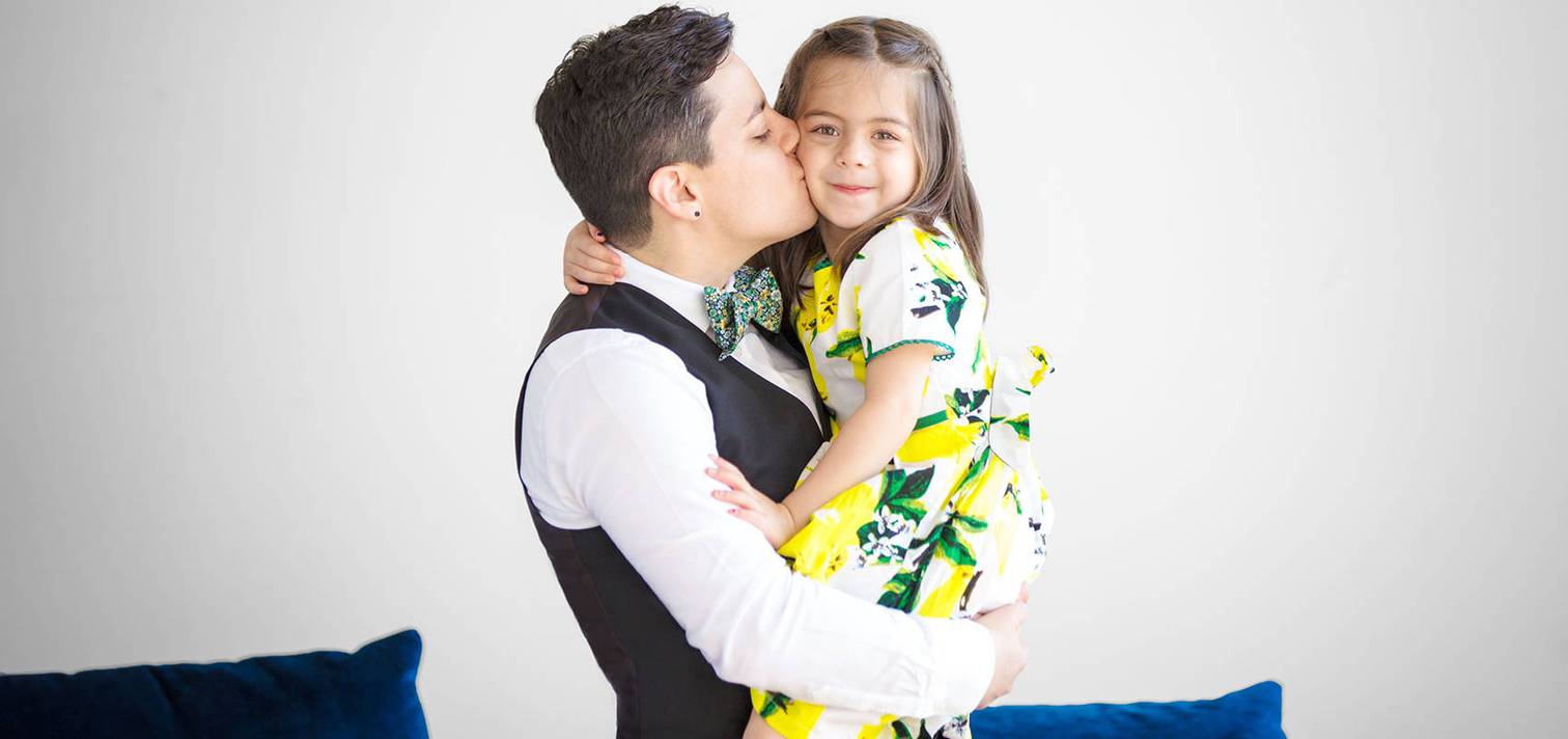 Betsy Rubinstein holding daughter