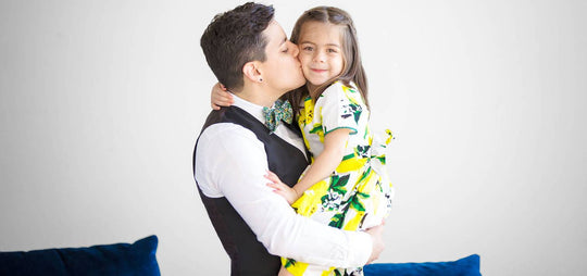 Betsy Rubinstein holding daughter