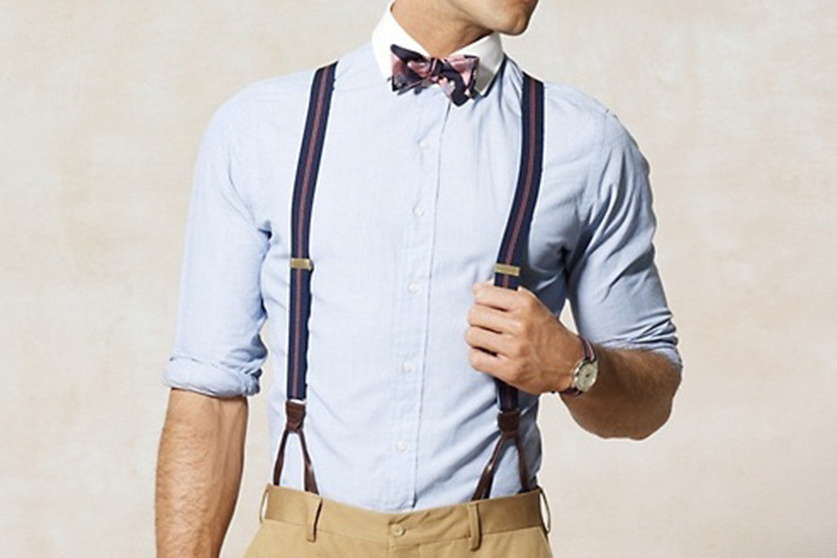 Model wearing dress shirt with striped suspenders