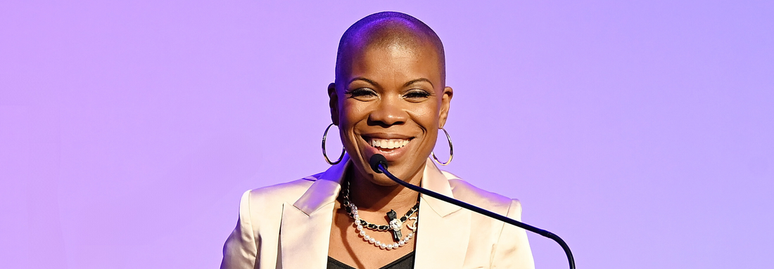 Dapper Scout Jaymes Black speaking at a podium