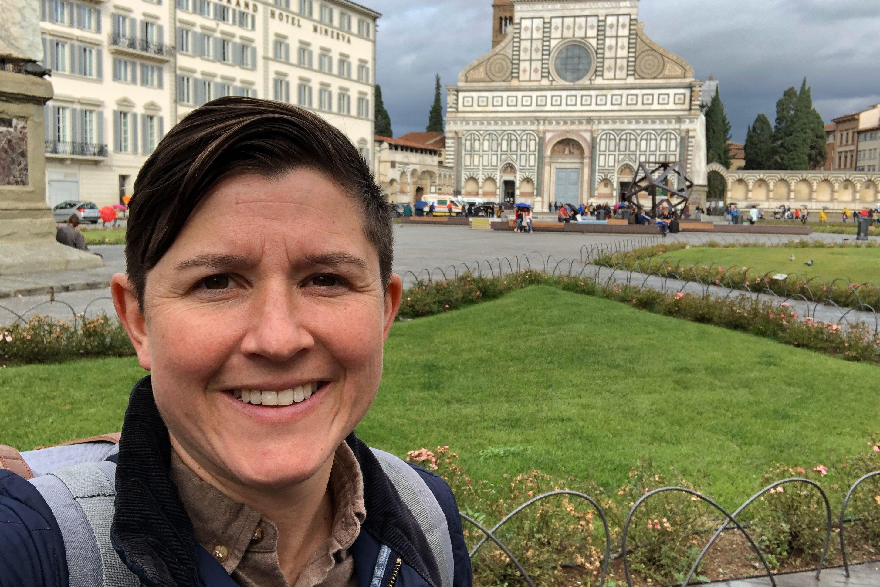 Kelly taking a selfie in an Italian courtyard. 