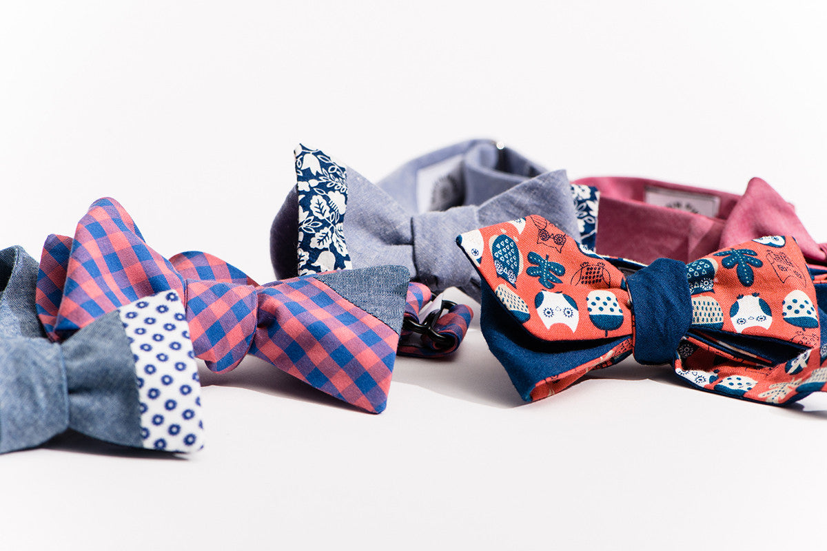 Collection of bow ties on white surface