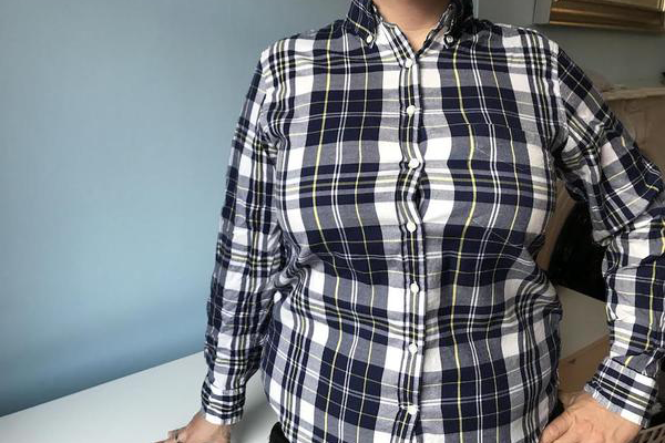 Image showing how a chest can cause a gap between buttons on a shirt.