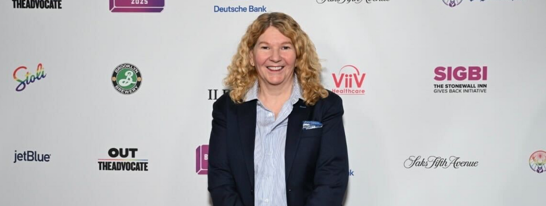 Banner image of Stacy Lentz standing in front of a white wall full of brand logos