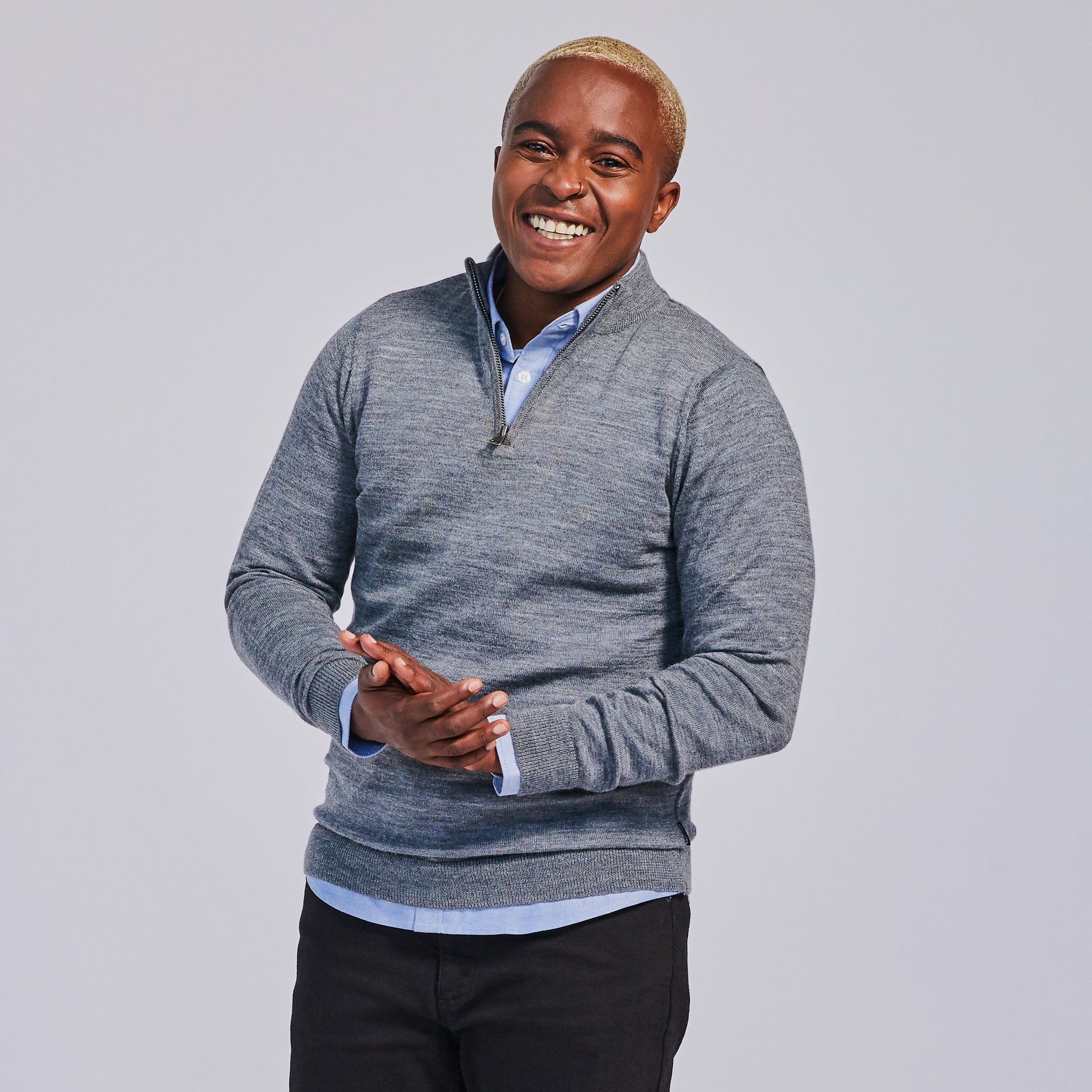 Masc model in gray quarter-zip fall sweater