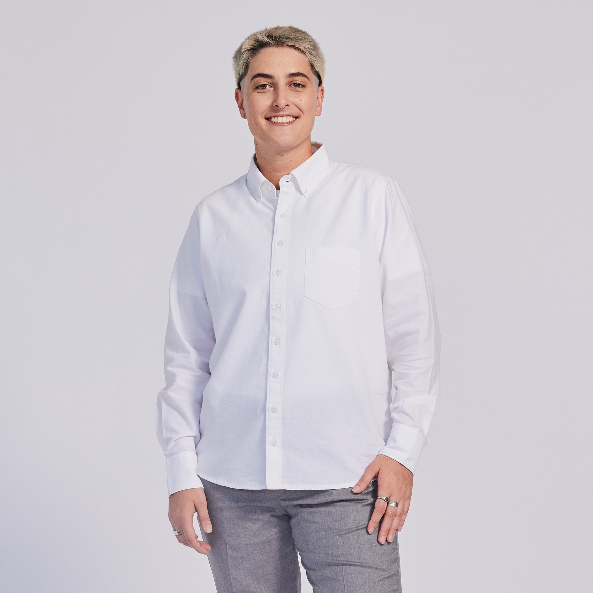 Masc model in white Oxford button down shirt