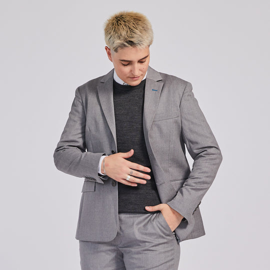 Ribbed Charcoal Merino Wool Sweater paired with Light Gray suit blazer