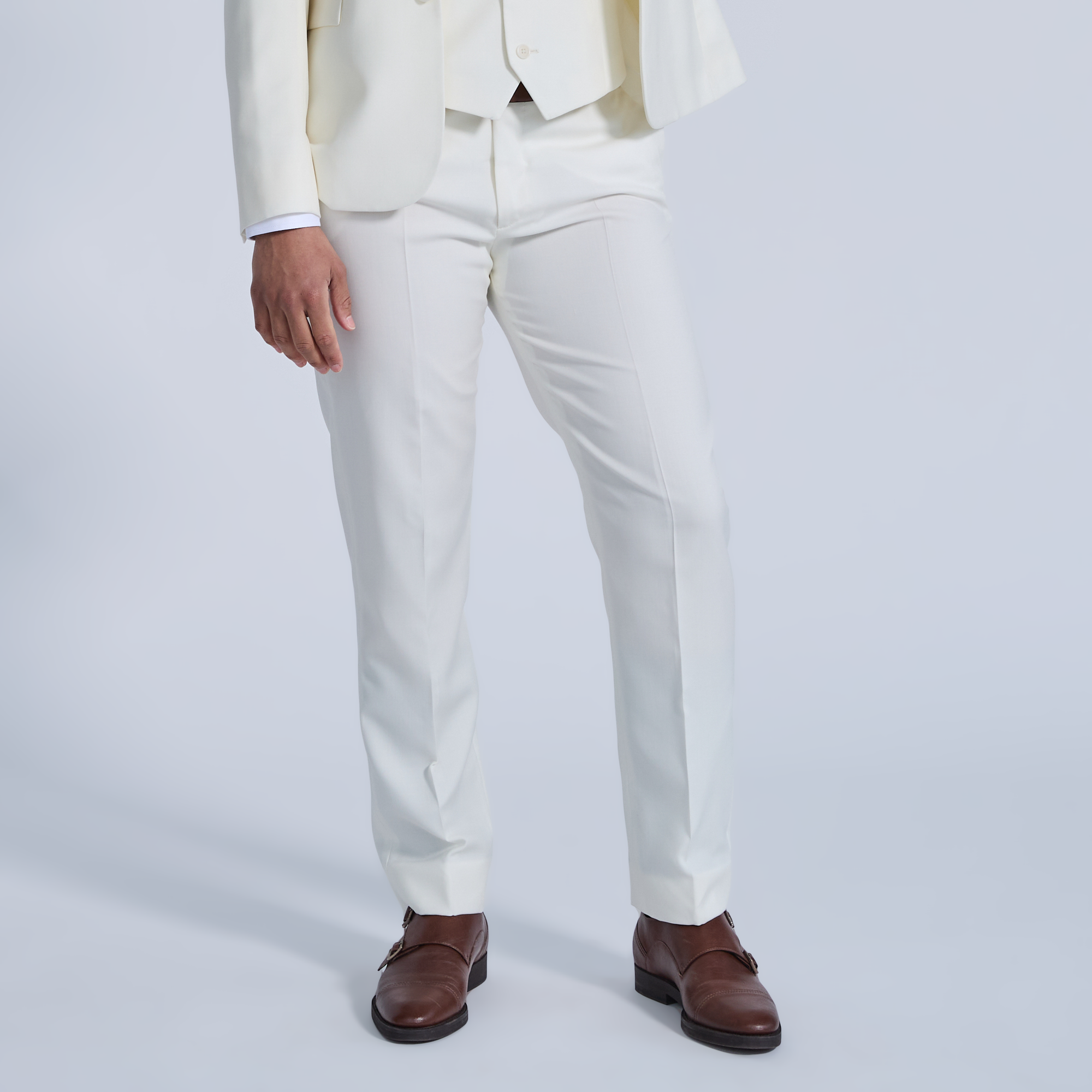 Model wearing Ivory Georgie dress pants with a white background. Color: Ivory