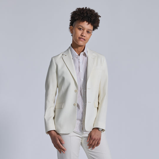 Non-binary model in Ivory Wedding Suit by Kirrin Finch