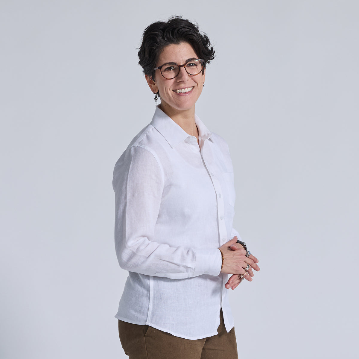 long sleeve white linen shirt worn by non-binary model