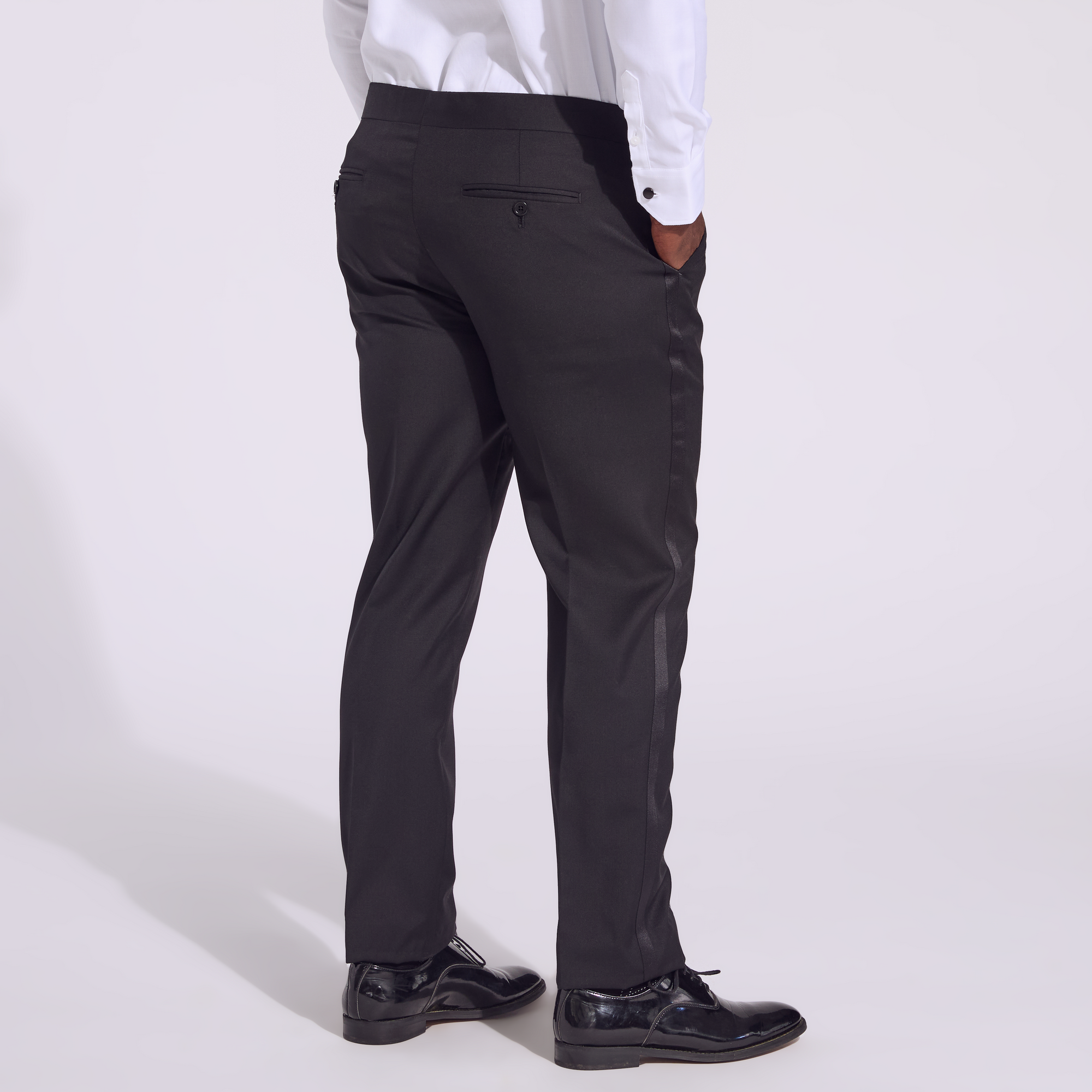 Transmasc model wearing Noir Tuxedo pants by Kirrin Finch