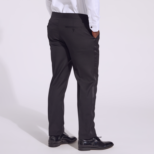 Transmasc model wearing Noir Tuxedo pants by Kirrin Finch