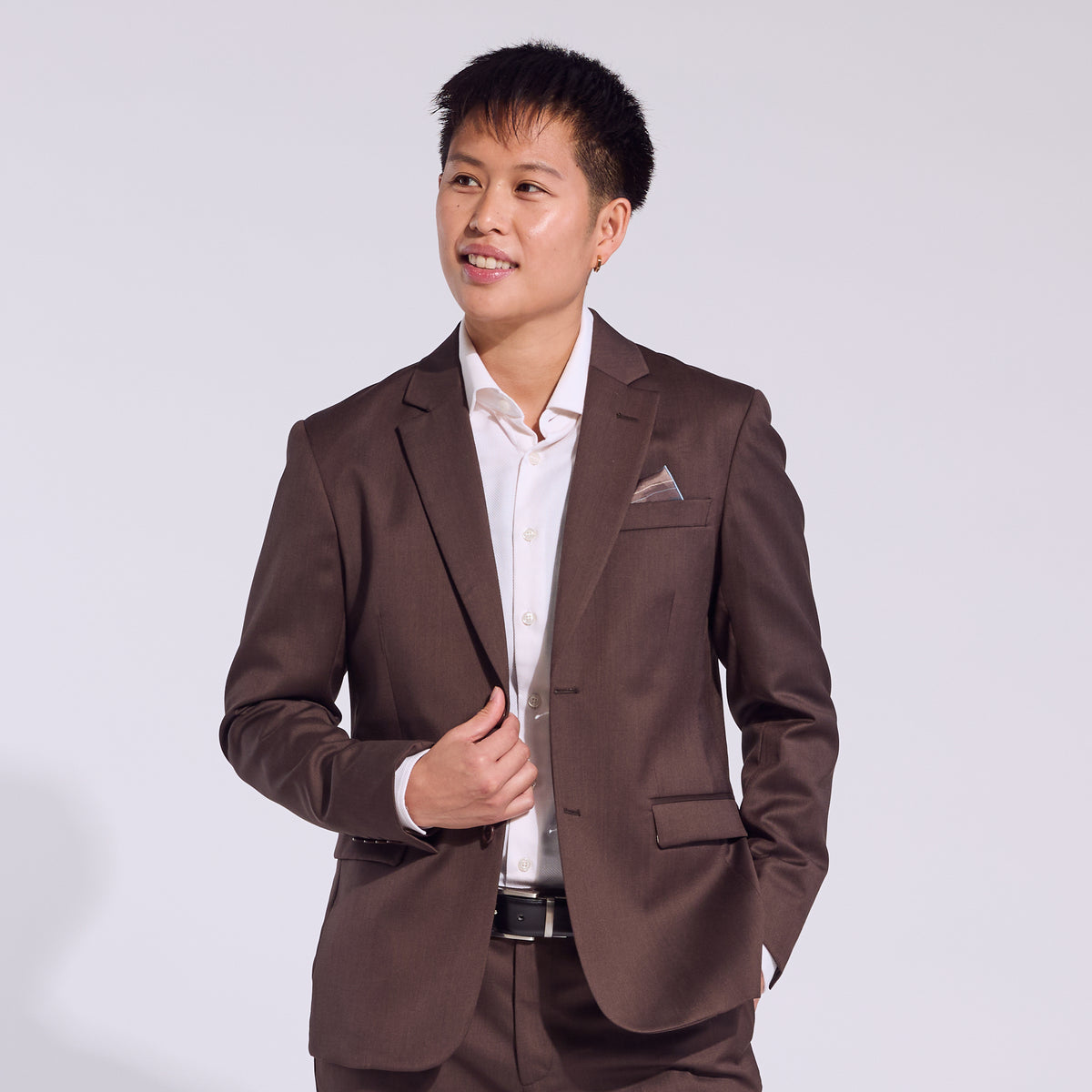 Masc person in the Georgie Chocolate Brown suit