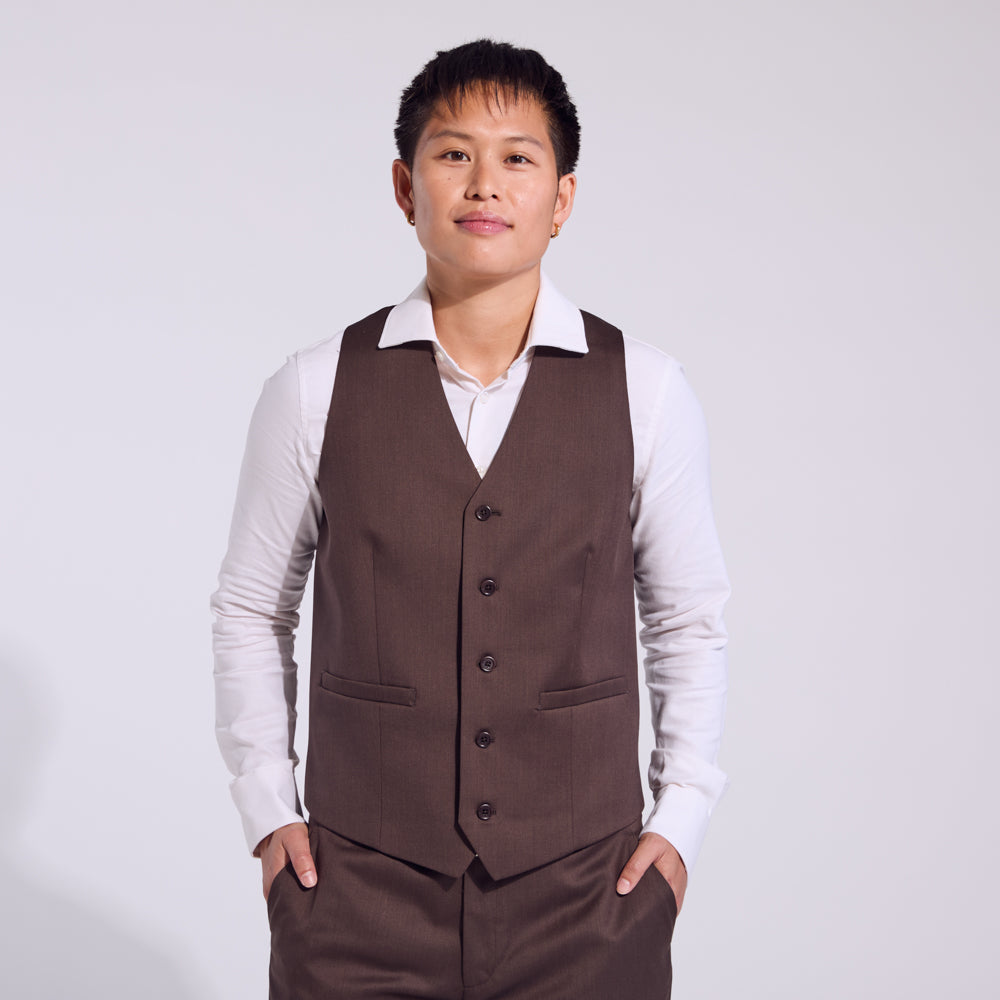 Model wearing the chocolate Georgie vest made by Kirrin Finch. Color: Chocolate