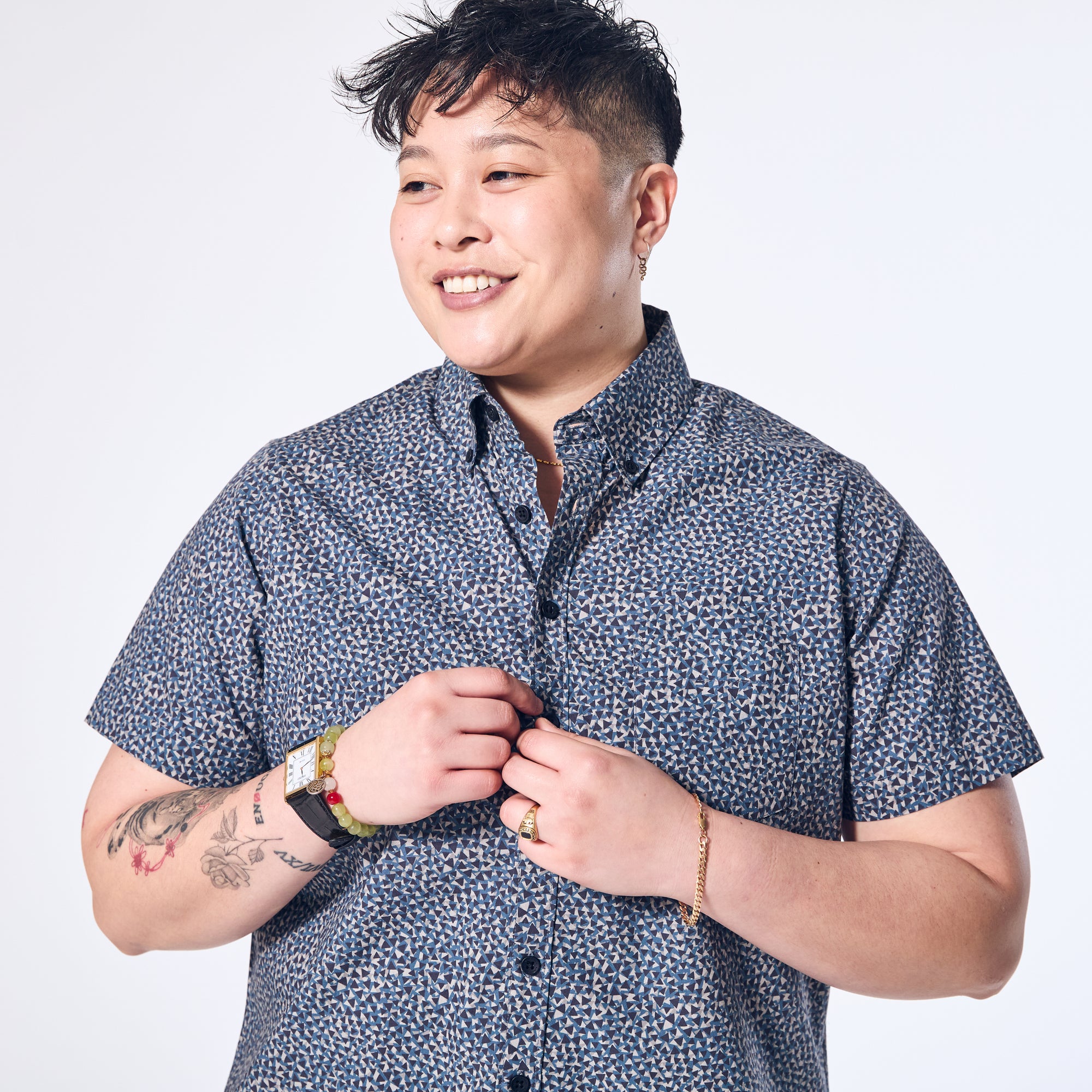 Women's short sleeve button down with small triangle print.