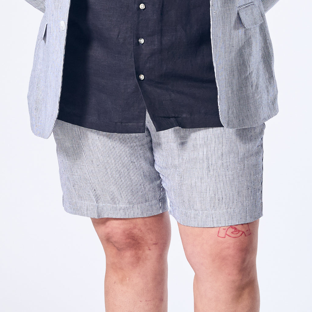 Blue stripe linen shorts made for women, trans, masc, and non-binary folk.