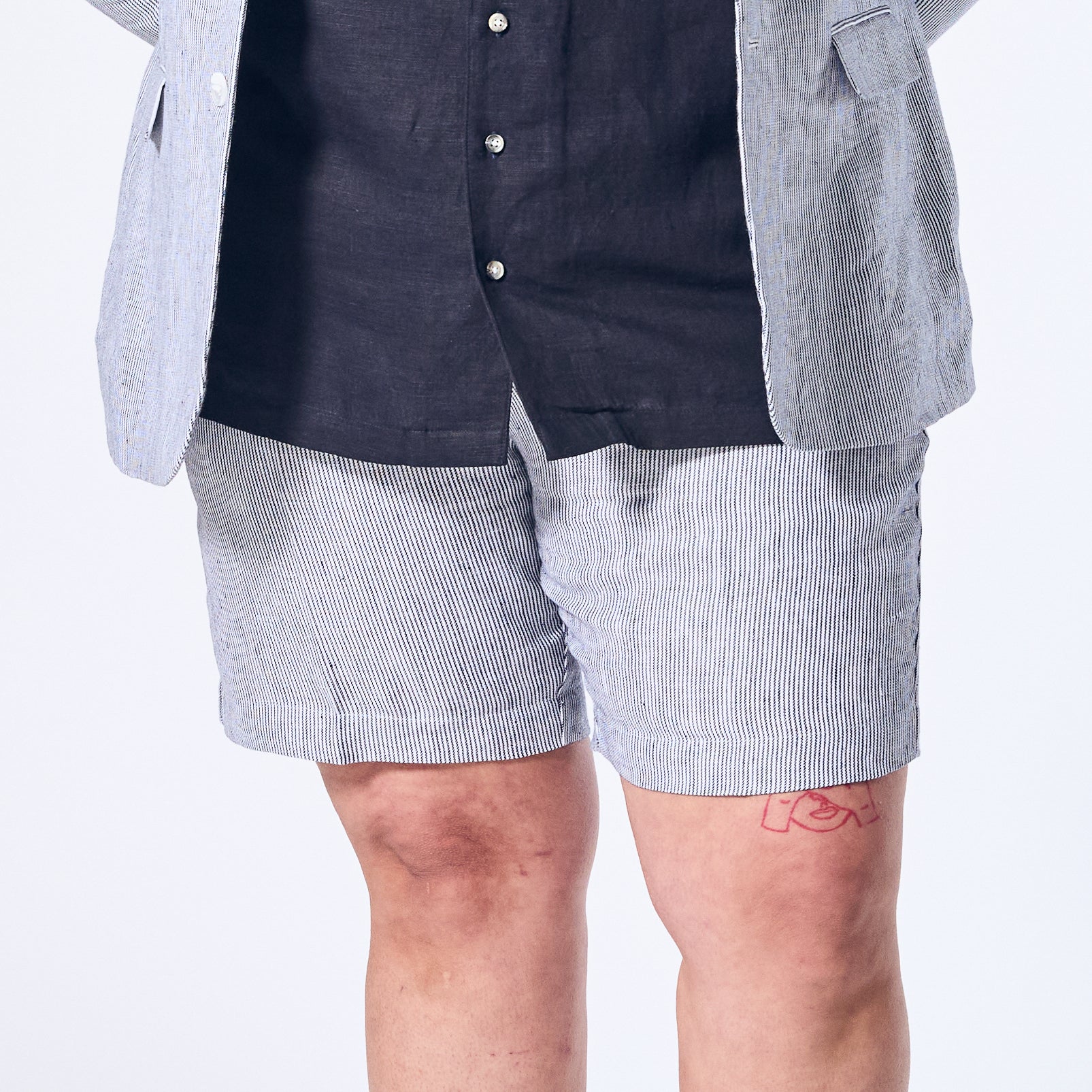 Blue stripe linen shorts made for women, trans, masc, and non-binary folk.