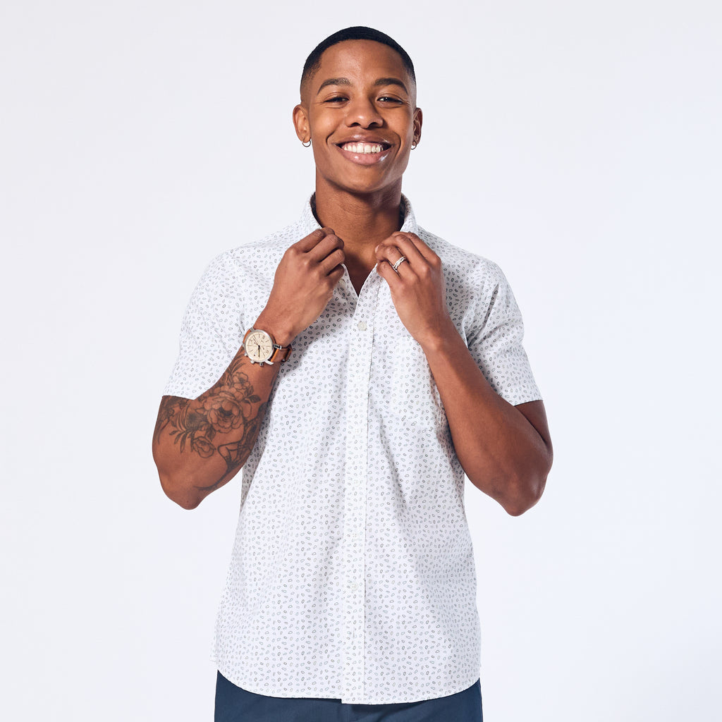 White short sleeve button up shirt made for women, trans, masc, and non-binary folk.