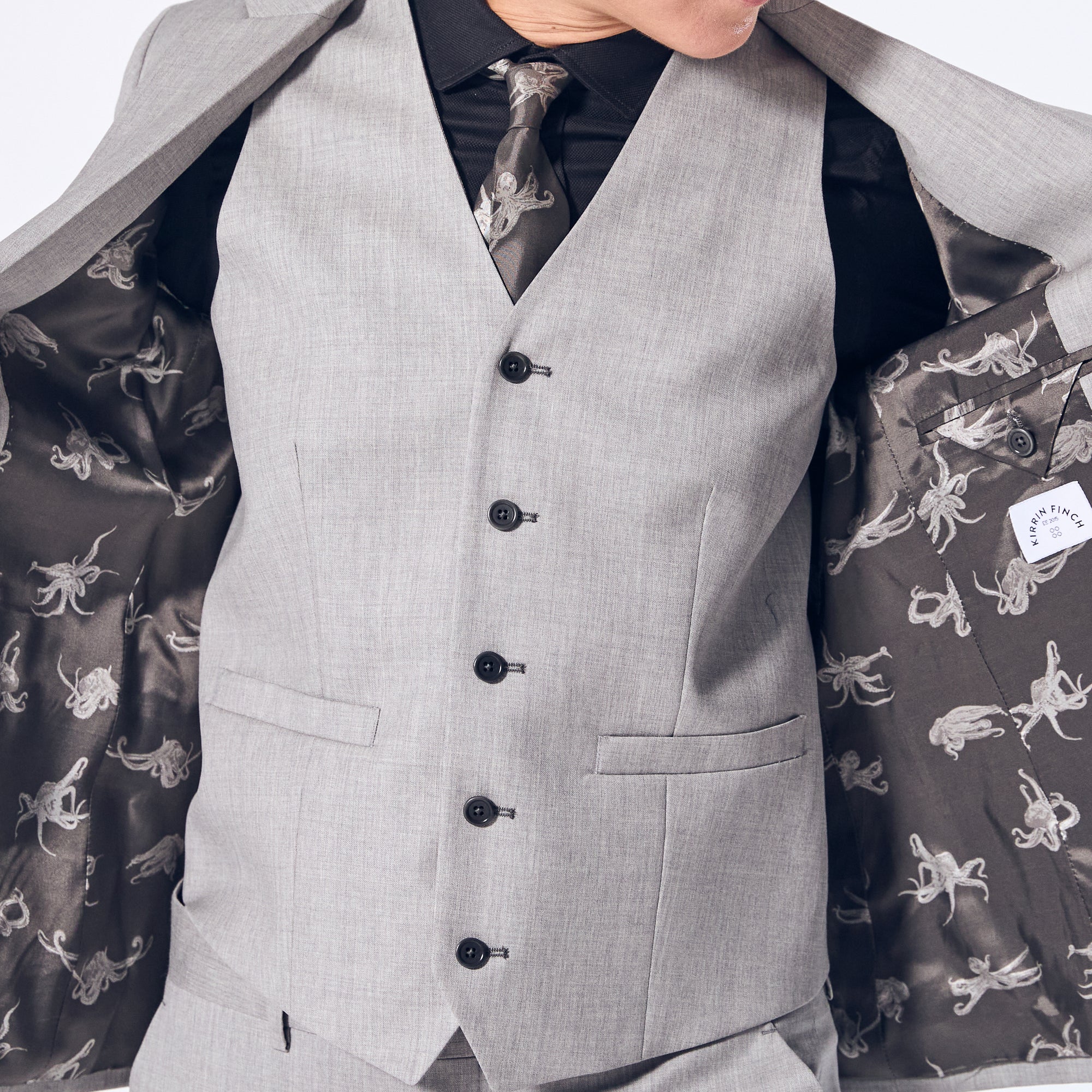 Sky Grey vest with charcoal button holes and adjustable back clasp.