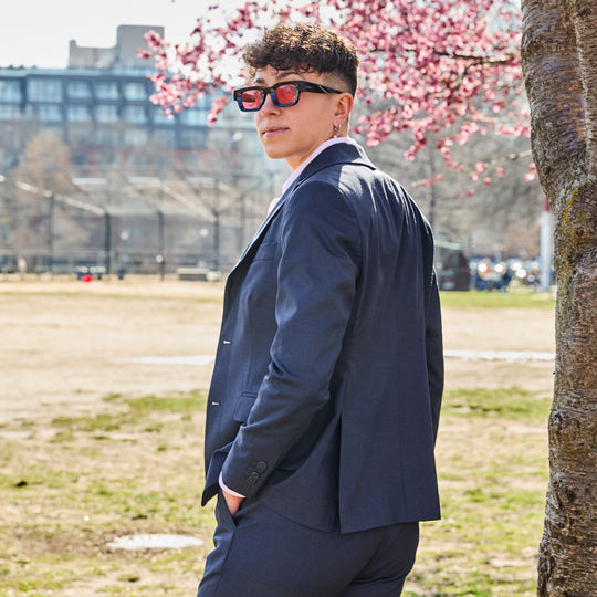 The Scout Ink Blue Suit Blazer made by Kirrin Finch with cherry blossoms in the background