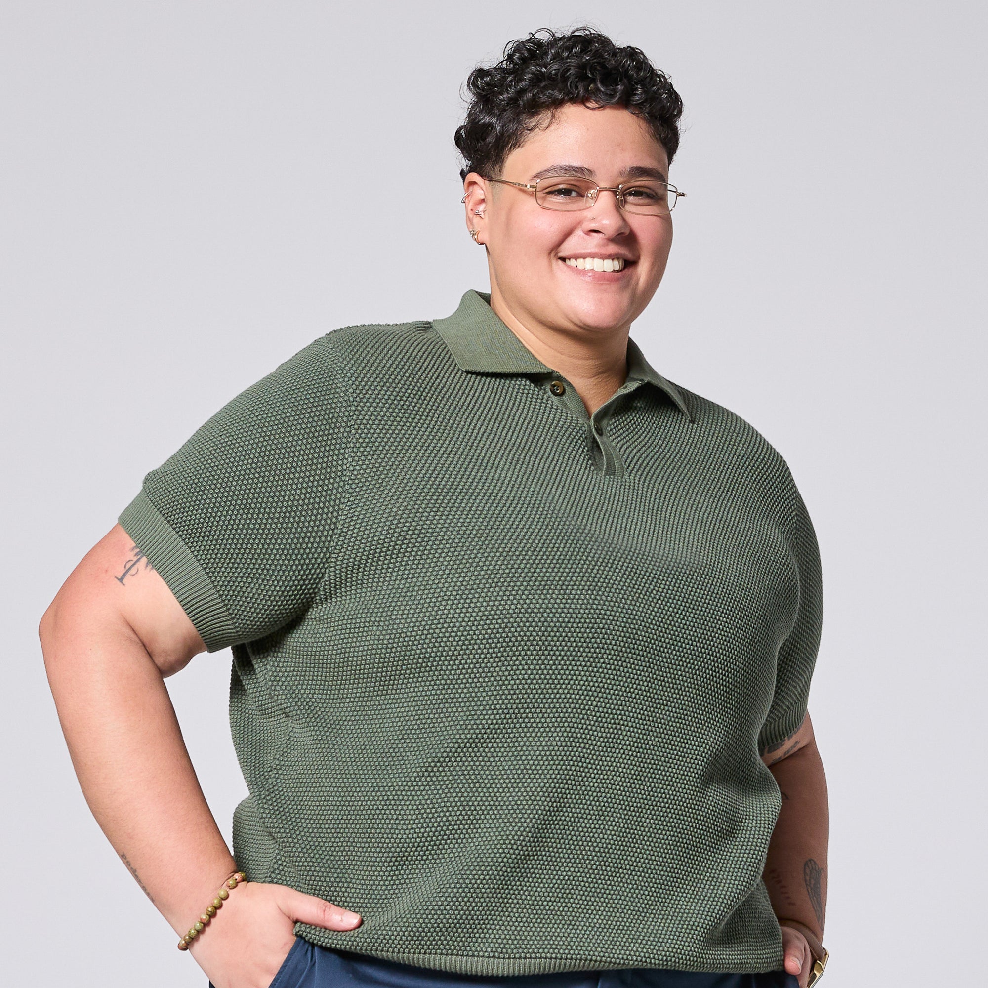 Androgynous model wearing The Hedge Green Pique Polo by Kirrin Finch
