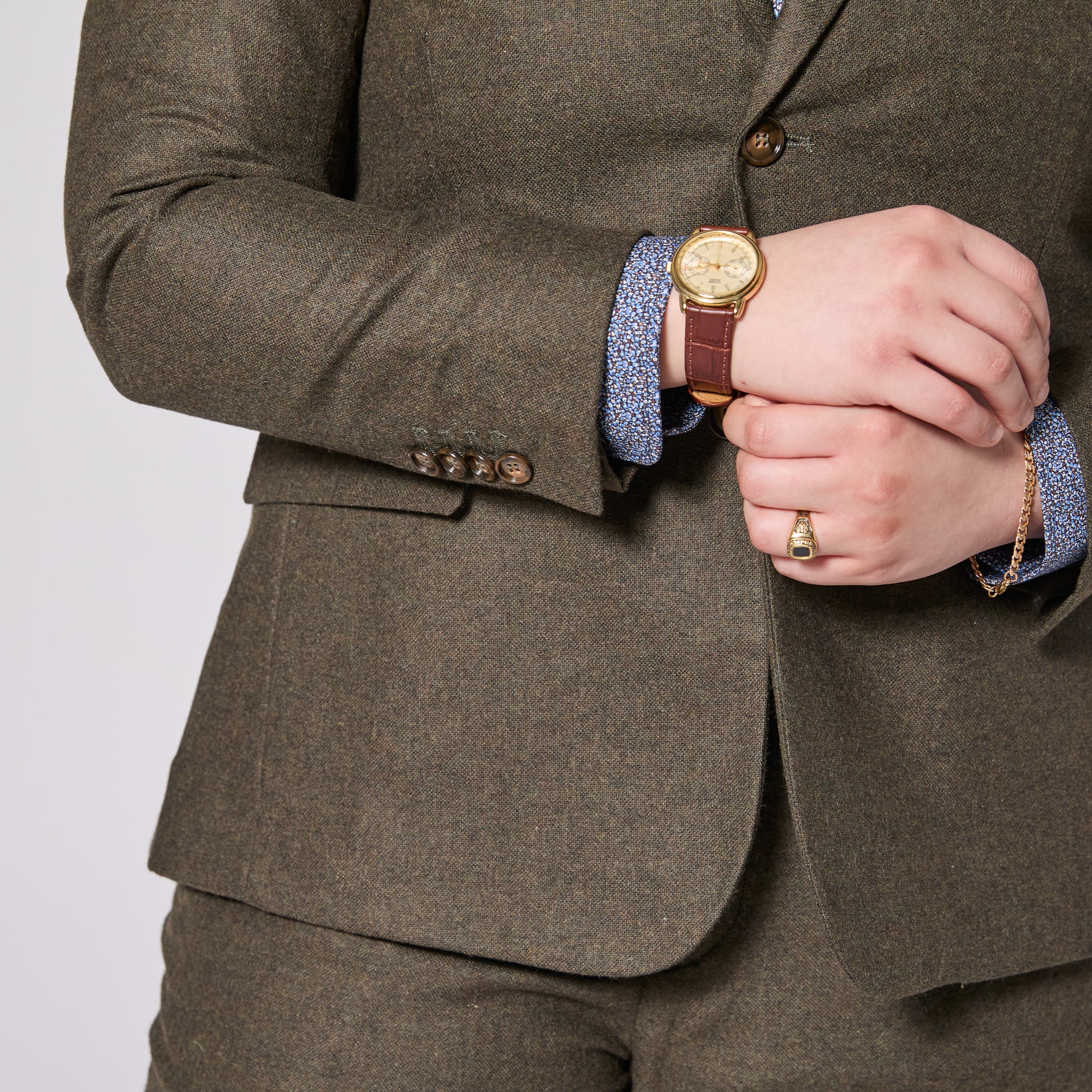 The Finch Heather Olive Flannel Suit Blazer featuring eco-friendly faux horn buttons.