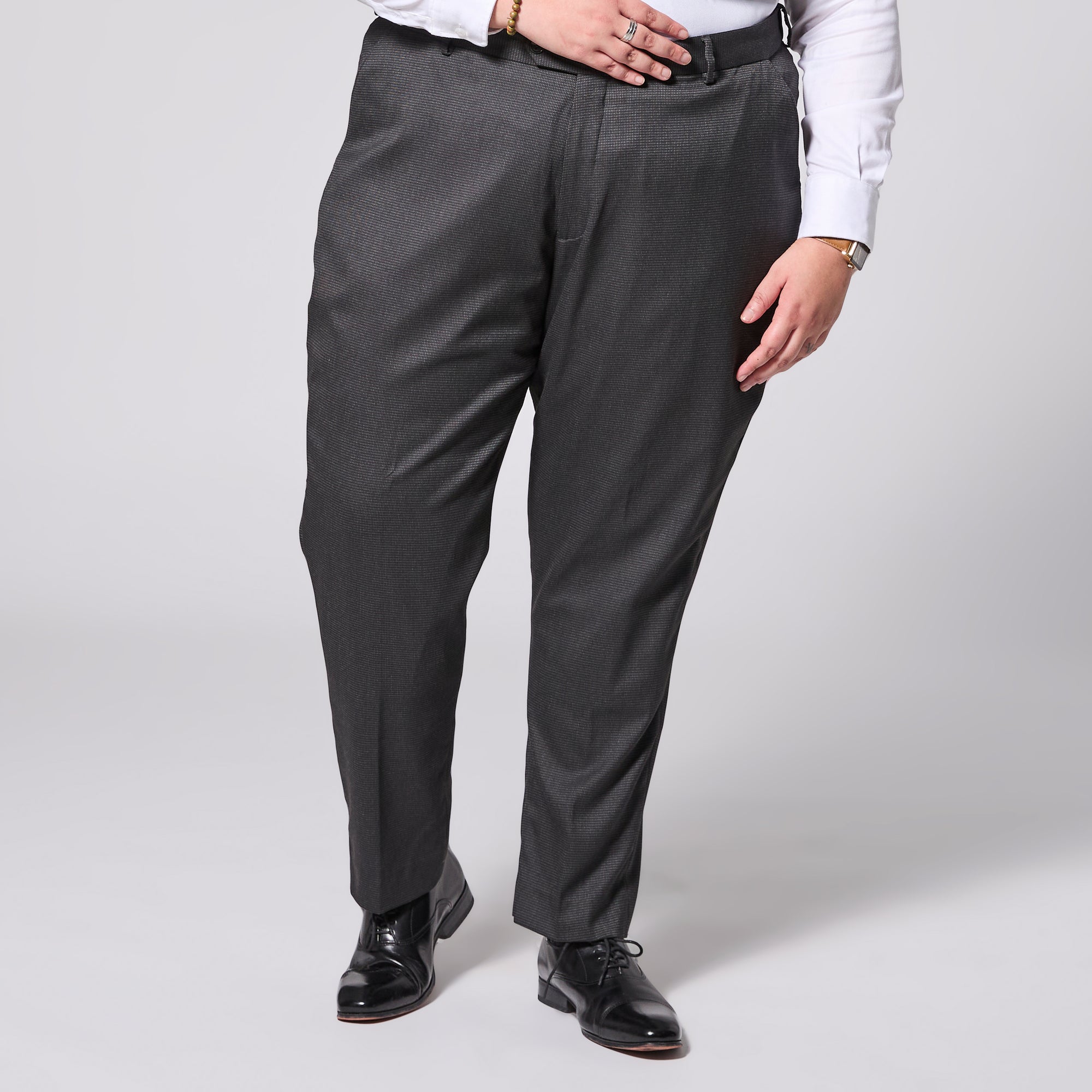 Model wearing Black Pearl Dress Pants made by Kirrin Finch on a light gray background