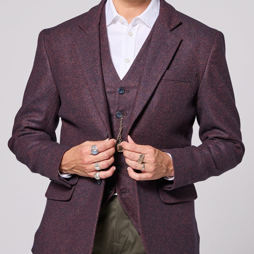 Abdrogynous person in mulberry twill blazer and best for women, trans, and non-binary folk