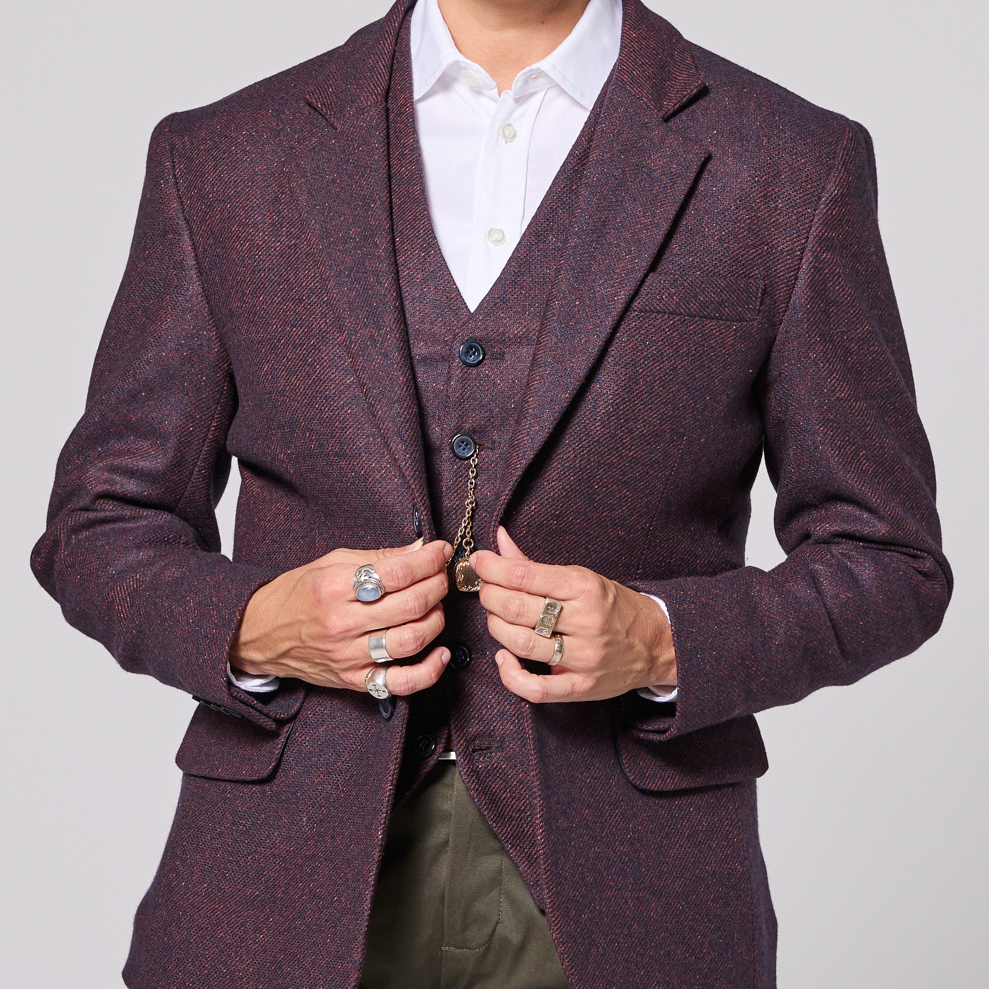 Abdrogynous person in mulberry twill blazer and best for women, trans, and non-binary folk