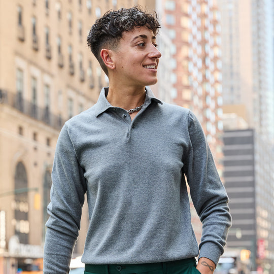 Women's gray long sleeve polo sweater with button placket collar.