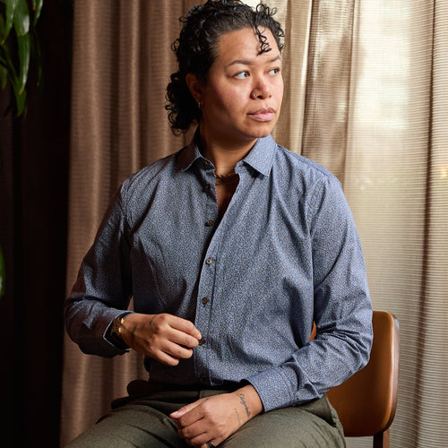 Model wearing Frankie Murano Classic Dress Shirt sitting in a chair. Color: Murano
