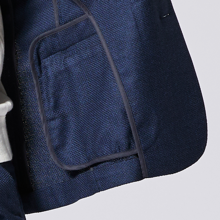 Navy blue textured blazer pocket shot from  the inside.  Color: Navy Textured