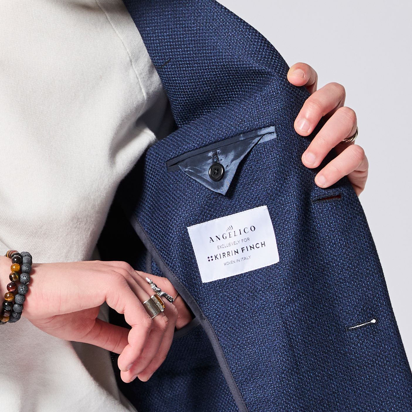 Navy blue textured blazer with Kirrin Finch label behind front chest pocket. Color: Navy Textured