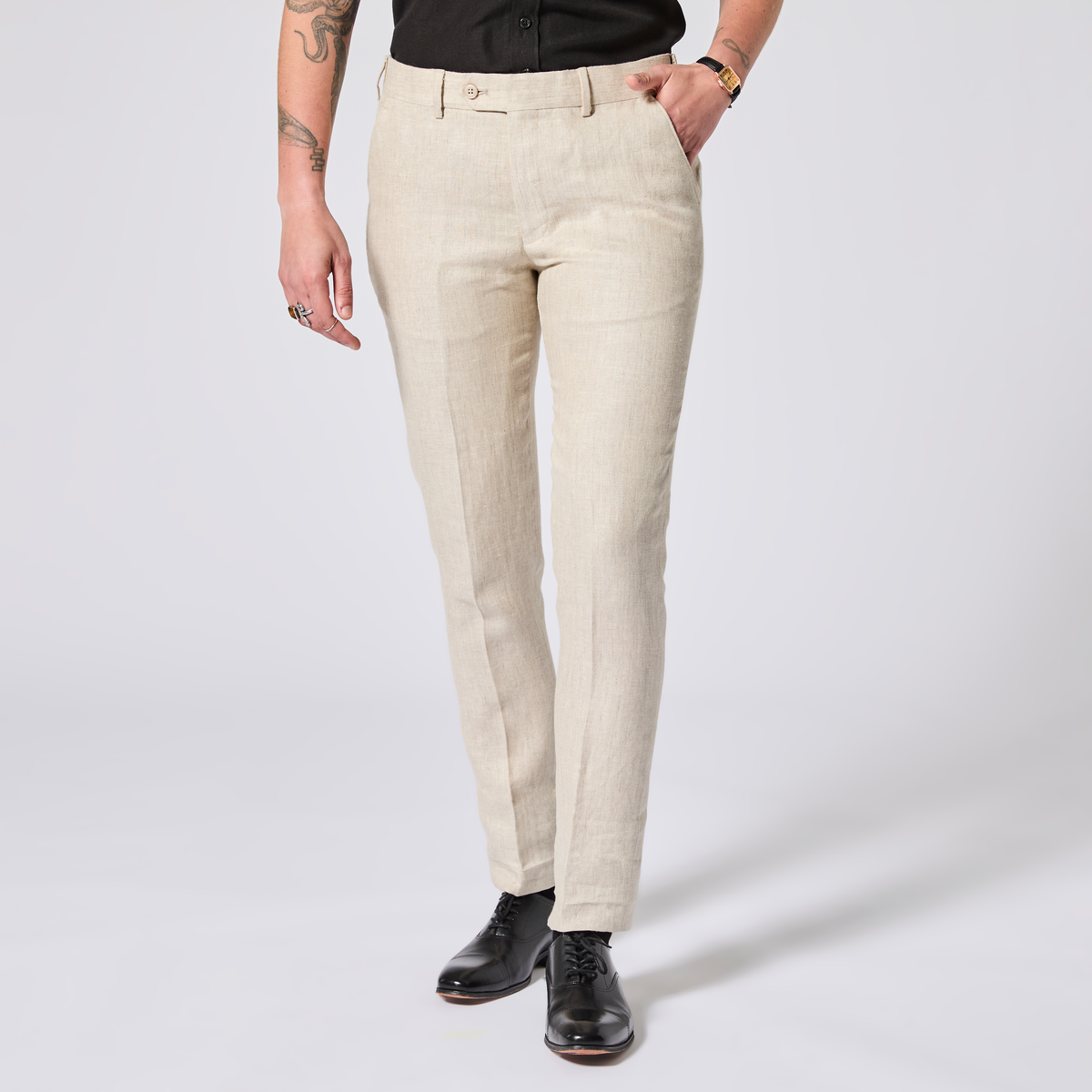 Person wearing beige pants on a white background. Color: Khaki Herringbone