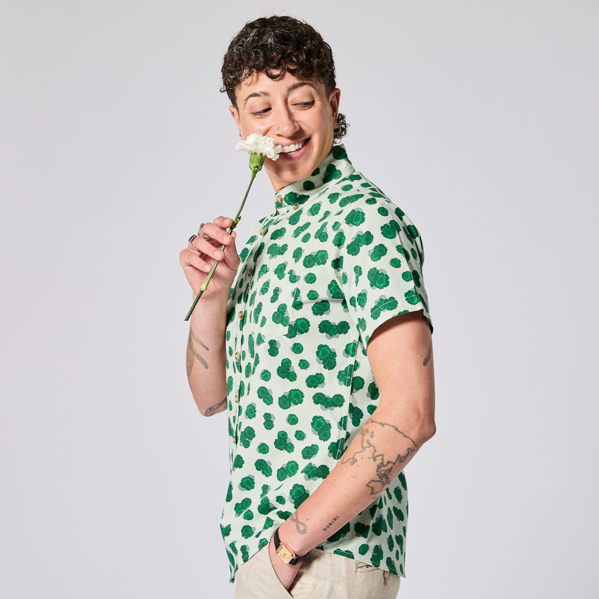 Green Carnation short sleeve shirt made for women, trans, masc and non-binary folk. Color: Green Carnation