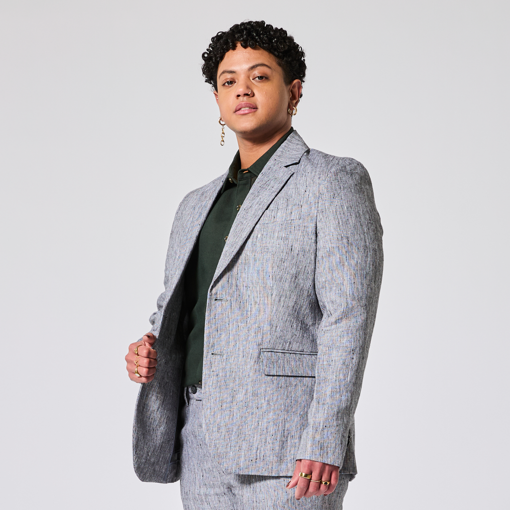 Person wearing a gray suit on a light gray background. Color: Graphite