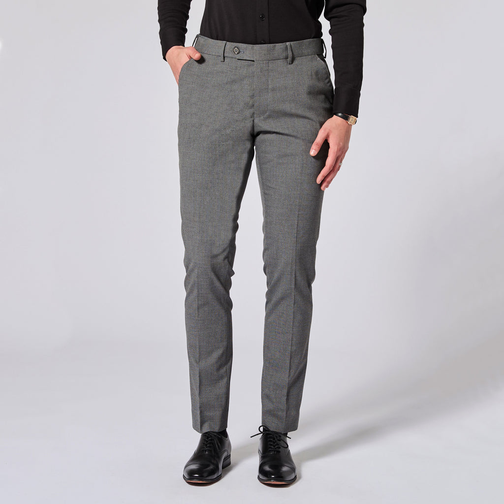 Person wearing gray pants and black shoes on a white background. Color: Gray Lattice