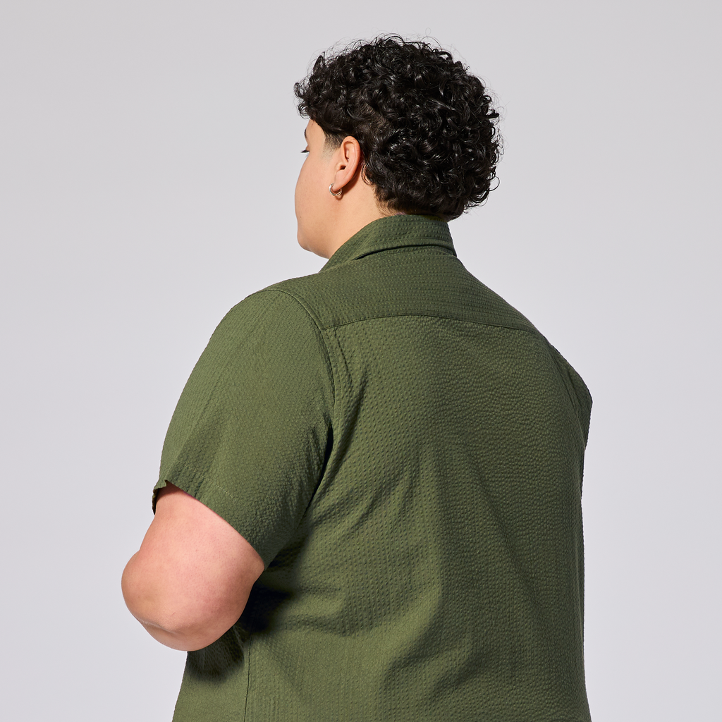 Green short sleeve shirt against made for woman, trans, masc and non-binay folk. Color: Nopales
