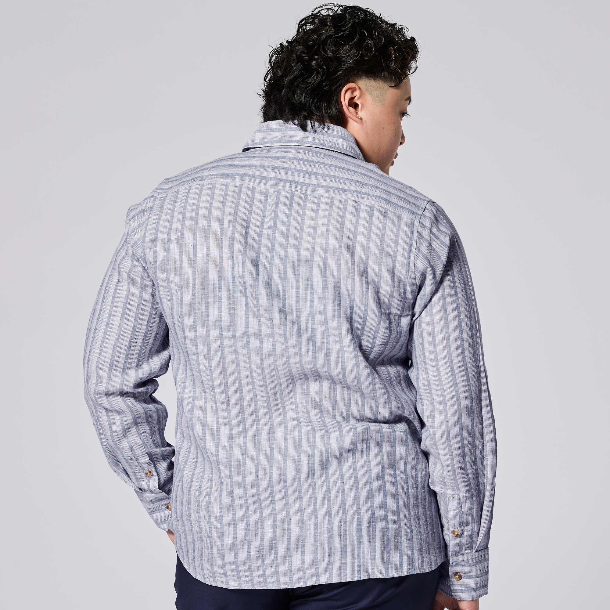 Back of the coastal blue long sleeve shirt made for women, trans, masc and non-binary folk. Color: Coastal Blue