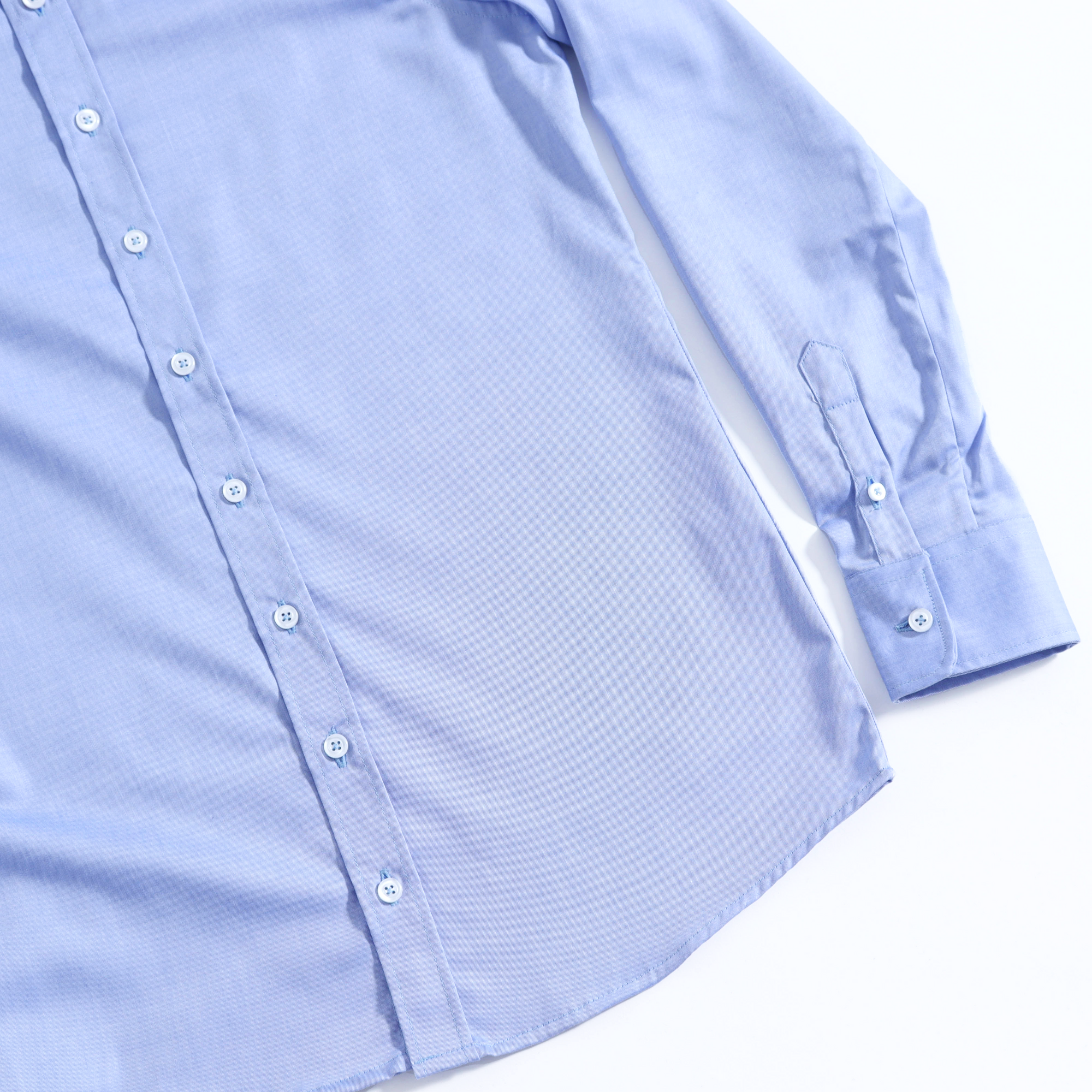 Flatt lay shot of the light blue Frankie dress shirt on a solid white background.  Color: Light Blue