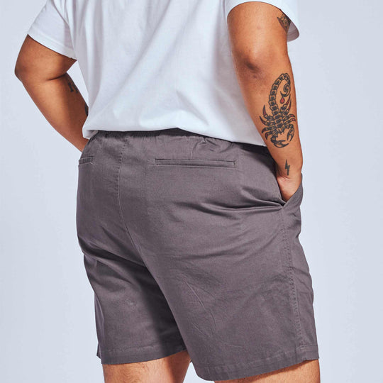 Deep pocket gray shorts for women on masculine presenting model