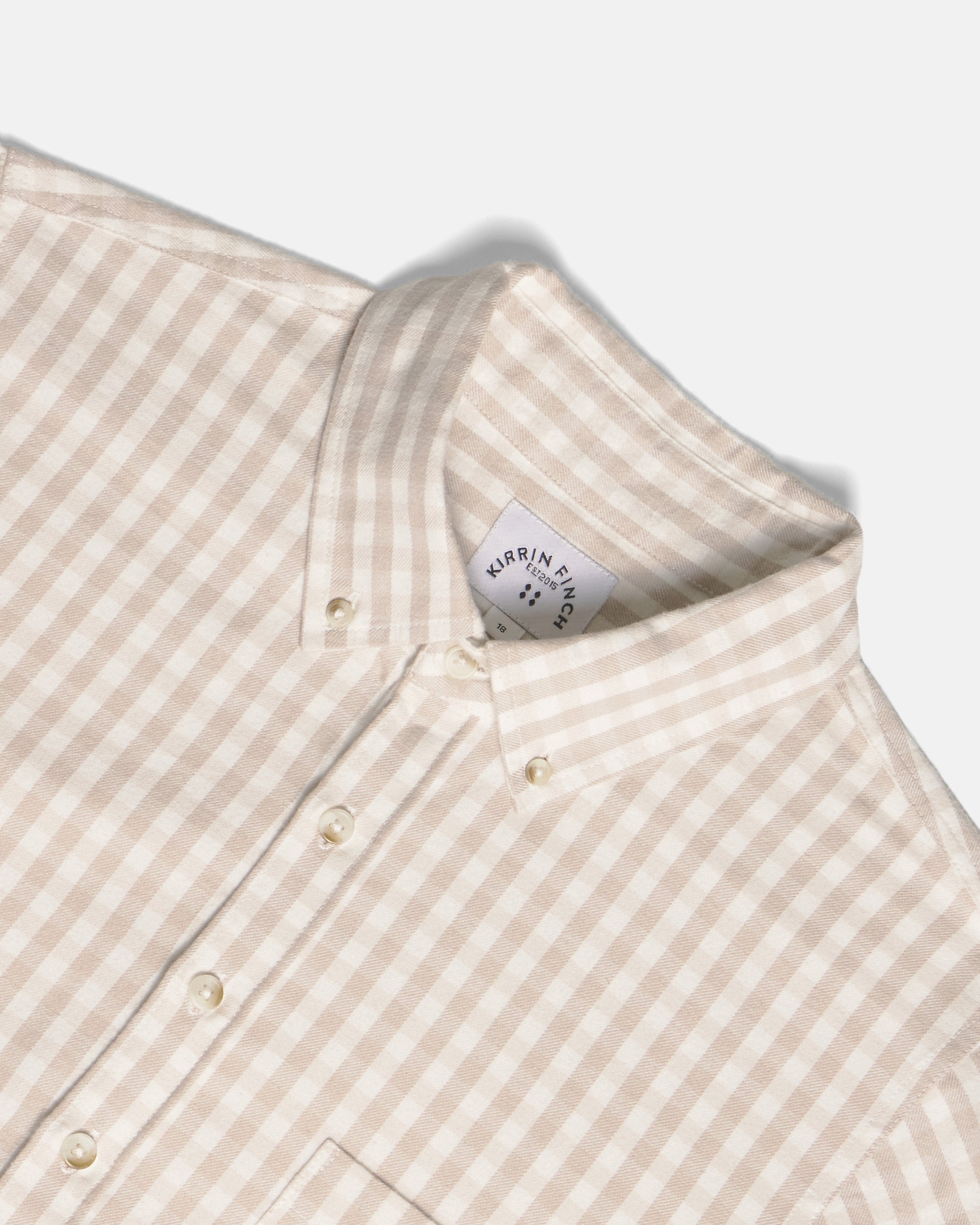 Close-up of a beige and white gingham button-down shirt collar. Color: Cream Check
