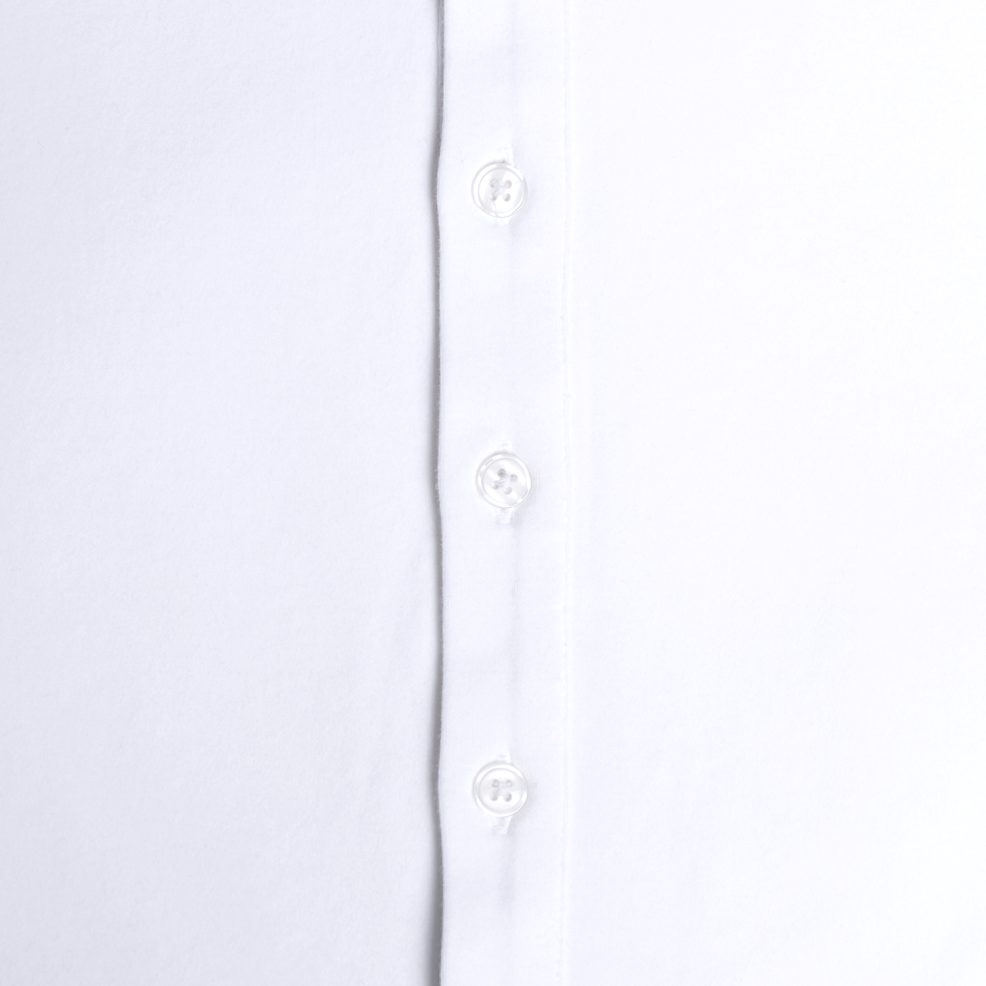 Close-up of a white shirt with button details on a light gray background. Color: White