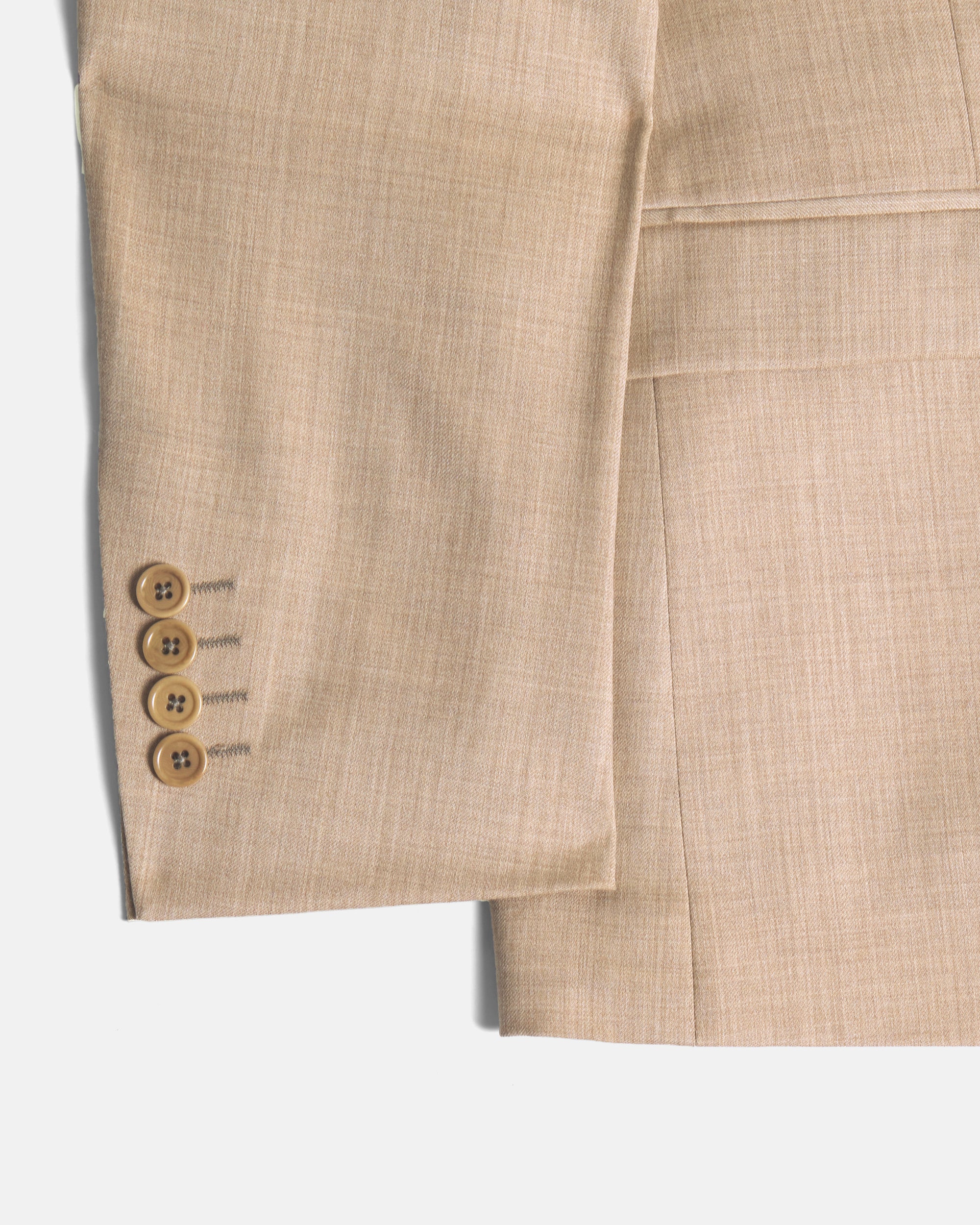 Close-up of a beige suit with buttons on a white background. Color: Desert