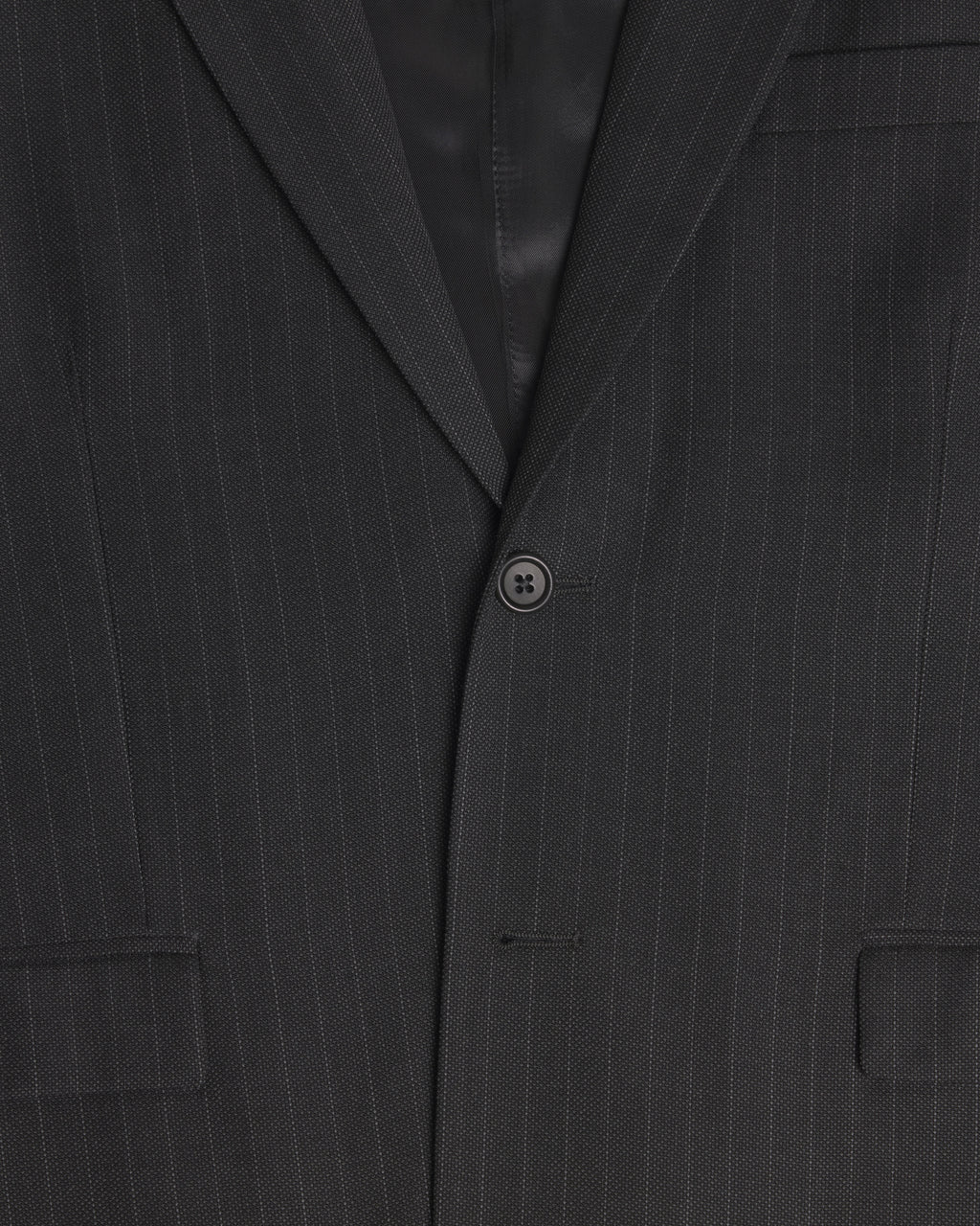 Close-up of a dark charcoal gray pinstripe suit jacket, showing the fine vertical stripes, a single button closure, and the lapel. Color: Shadow Pinstripe