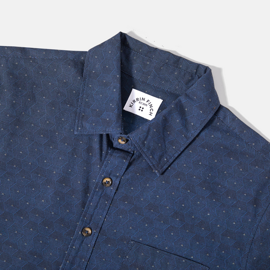Close-up of Blue Hexagon Point Collar Shirt and Kirrin Finch logo 